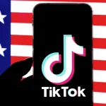 TikTok Develops New App Version Ahead of US Sale tiktok-phone-american-flag-GettyImages-1246687576-2400-1500x1000