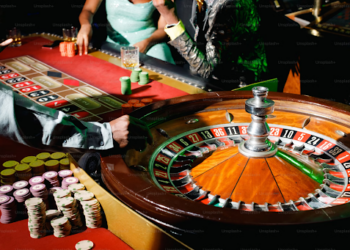 A dealer spins the roulette wheel