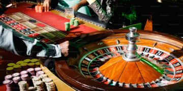 A dealer spins the roulette wheel