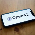 51f176-20250930-a-smartphone-displaying-the-logo-of-the-artificial-intelligence-openai-research-laboratory-2000