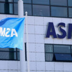 FILE PHOTO: An ASML flag and signage at the company's offices in Veldhoven