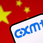 CXMT Surges 470% As China Bets Big On AI Memory Chips FILE PHOTO: FILE PHOTO: Illustration shows CXMT logo and Chinese flag