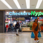 South African Shoppers Still Trust Local Stores Shoppers leave after shopping at an outlet of retailer Checkers in Sandton