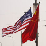 US-China AI Safety Talks Run Into A Trust Problem National flags of China and the United States flutter on a road, ahead of the U.S. President's state visit to China, in Beijing
